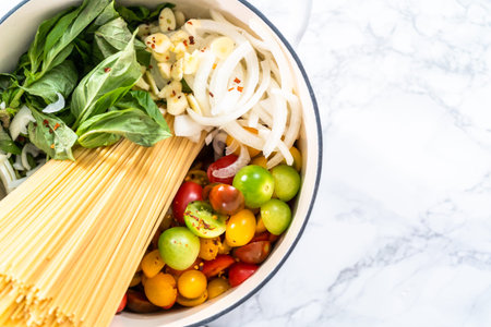 Ingredients to prepare vegetarian one pot pasta in enameled cast iron dutch oven.