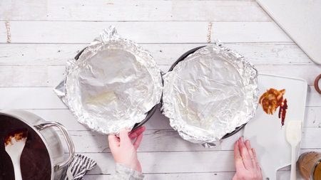 Flat lay. Step by step. Greasing baking pan to make homemade fudge.の写真素材