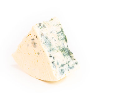 Large slice of blue cheese on a white background.