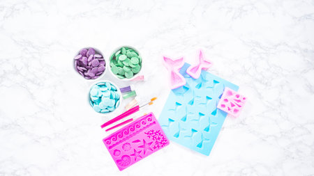 Melting color chocolate chips for making mermaid chocolate molds.の写真素材