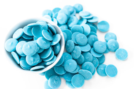 Blue round chocolate chips for melting chocolate shapes.の写真素材