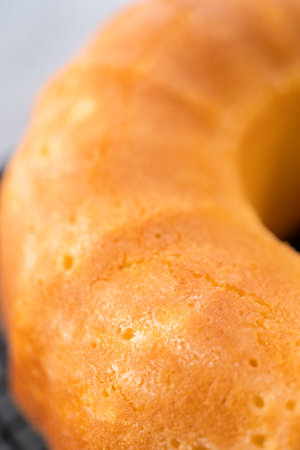 Cooling lemon cranberry bundt cake on a kitchen drying rack.の写真素材