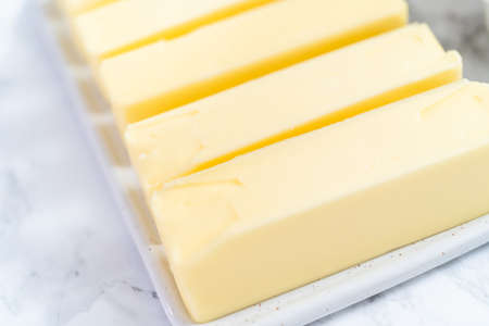 Sticks of butter at room temperature for baking.の写真素材