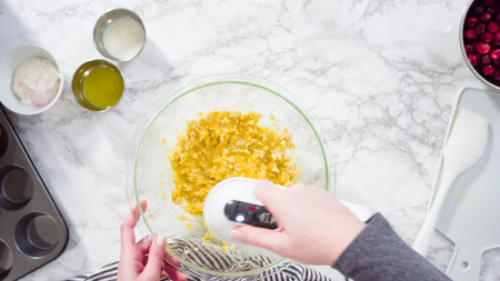 Flat lay. Step by step. Mixing ingredients in a mixing bowl to bake cranberry muffins.