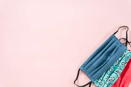 Homemade face masks for coronavirus outbreak on a pink background.の写真素材