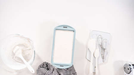 Flat lay. Preparing homemade coconut ice cream with roasted coconut flakes.の写真素材