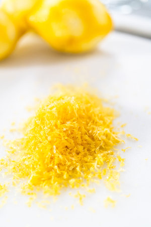 Zesting organic lemons to bake a lemon pound cake.