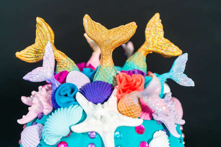 Halloween craft pumpkins decorated with mermaid tails, glitter, and sparkly rhinestonesの写真素材