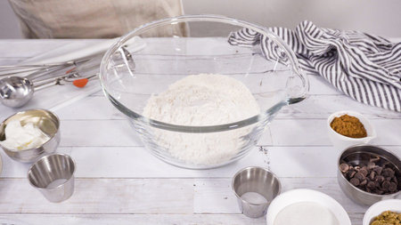 Mixing ingredients to bake chocolate raspberry cupcakes.
