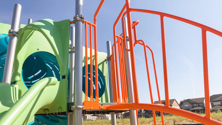 Modern children playground in the suburbs on a hot summer day.