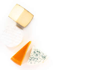 Variety of large wedges gourmet cheese on a white background.の写真素材