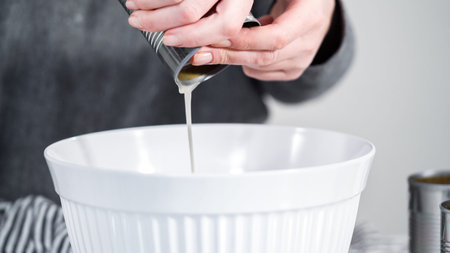 Openning canned white beans with can opener.
