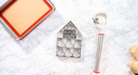 Baking sugar Christmas cookies in shape of Christmas trees.の写真素材