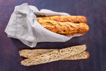 Flat lay. Freshly baked small French baguette bread.の写真素材