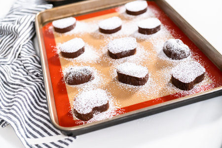 Unbaked chocolate cookies on a baking sheet.