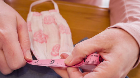 Sewing cotton face mask with a sewing machine for  virus outbreak.
