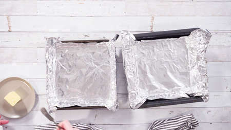 Flat lay. Step by step. Greasing baking pan to make homemade fudge.の写真素材