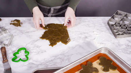 Step by step. Cutting out shapes with Christmas cookies cutter from gingerbread cookie dough.の写真素材