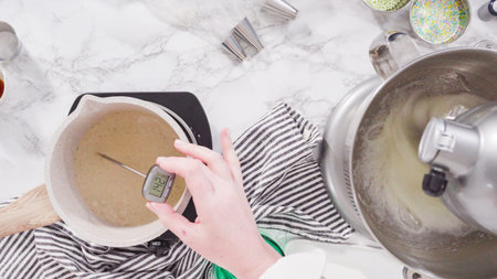 Caramelizing sugar in a saucepan for Italian buttercream frosting.