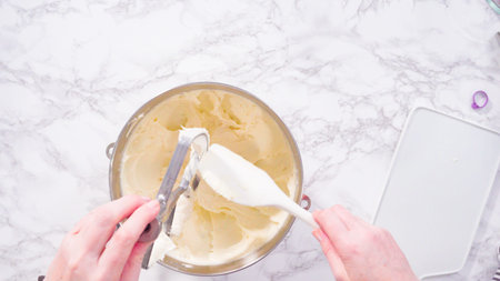 Flat lay. Step by step. Mixing ingredients in a standing kitchen mixer to prepare cream cheese...