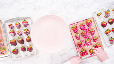 Flat lay. Step by step. Arranging a variety of chocolate dipped strawberries on a pink cake stand.