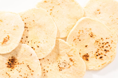 Flat lay. Close up view of homemade small flat bread. It is made with organic flour.の写真素材