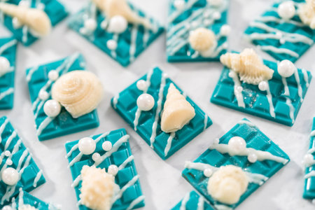 Mini mermaid chocolate bars drizzled with white chocolate, sprinkling with white pearl sugar...