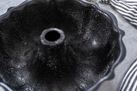Empty baking pan prepared to bake a lemon pound cake.の写真素材
