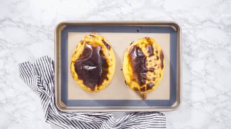 Step by step. Flat lay. Preparing organic spaghetti squash with olive oil, salt, and pepper.