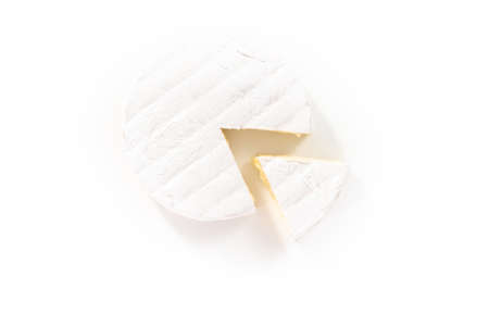Large slice of brie cheese on a white background.の写真素材