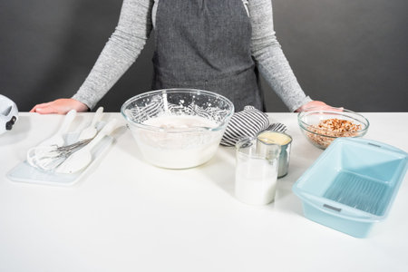 Preparing homemade coconut ice cream with roasted coconut flakes.