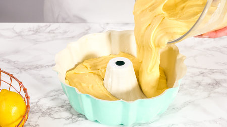 Step by step. Pouring cake batter in bundt cake pan ready for baking.