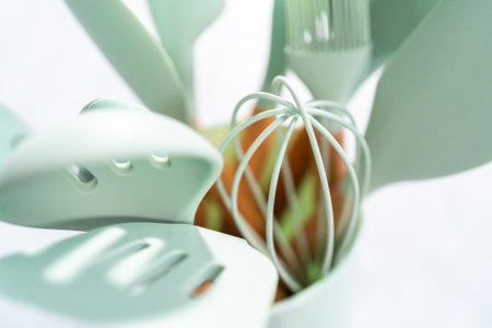 Silicone cooking utensils with wooden handle.