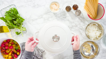 Flat lay. Step by step. Cooking on pot pasta recipe in an enameled cast iron dutch oven.の写真素材