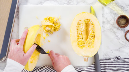 Step by step. Flat lay. Preparing organic spaghetti squash with olive oil, salt, and pepper.の写真素材