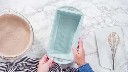 Flat lay. Step by step. Pouring homemade chocolate ice cream into a baking pan.の写真素材