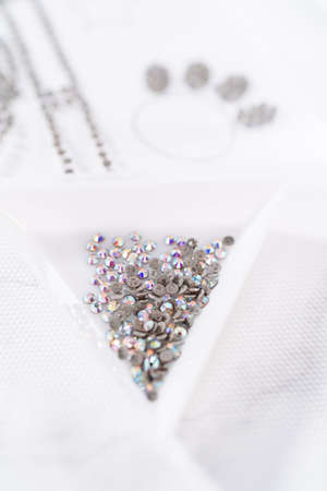 Placing rhinestones on top of rhinestone transfer film.の写真素材