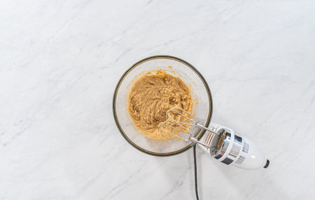 Flat lay. Mixing ingredients in a glass mixing bowl to bake chocolate graham crackers.