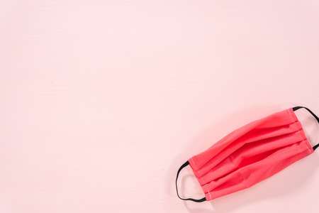 Homemade face masks for coronavirus outbreak on a pink background.の写真素材