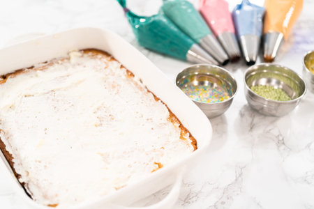 Sheet cake ready to be decorated with colorful buttercream frosting.