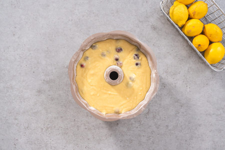 Flat lay. Cake batter in bundt cake pan ready for baking.の写真素材