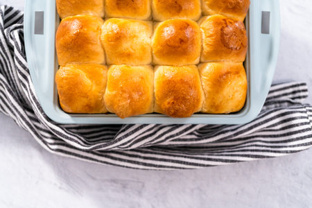 Freshly baked dinner rolls in the baking pan.の写真素材