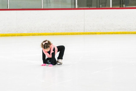 Little skater practicing her elements at the morning figure skating practice.