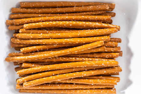 Ingredients in glass mixing bowls to prepare chocolate dipped pretzel rods for the July 4th...