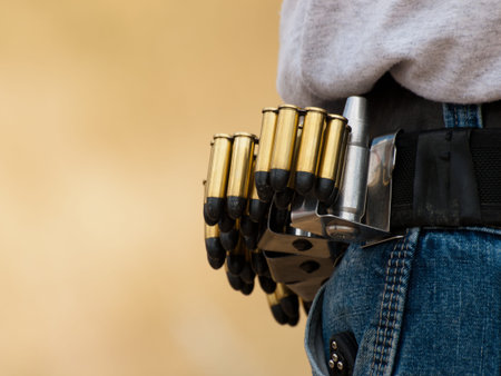 Man with loaded moon clips for revolver.