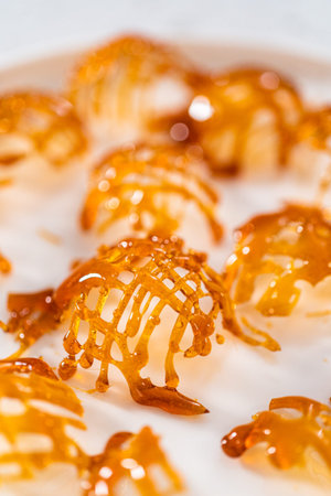 Crunchy caramel cupcake toppers on the counter.