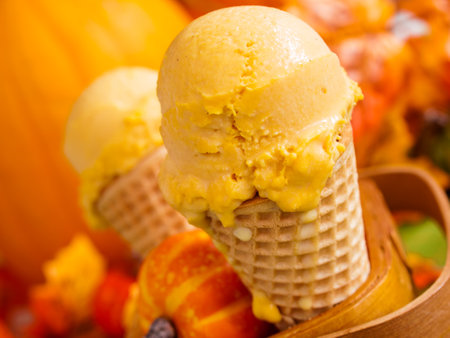 Scoop of gourmet pumpkin gelato in waffle cones.の写真素材