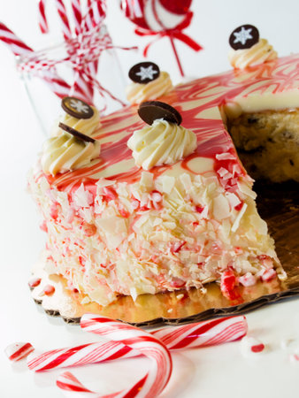 Traditional Christmas White Chocolate Peppermint Cheesecake on white background.