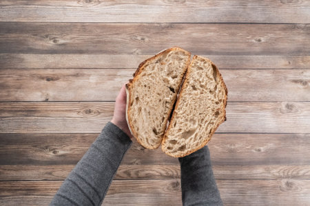 Flat lay. Sliced baked sourdough rye loaf of bread.