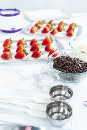 Ingredient for making chocolate dipped strawberries with organic strawberries.の写真素材
